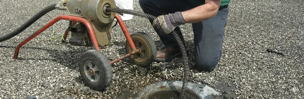 sewer rodding technician actively removing blockages from a sewer line in Allentown, PA